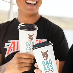 Bad Ass Coffee of Hawaii franchise customers cheers their coffee cups
