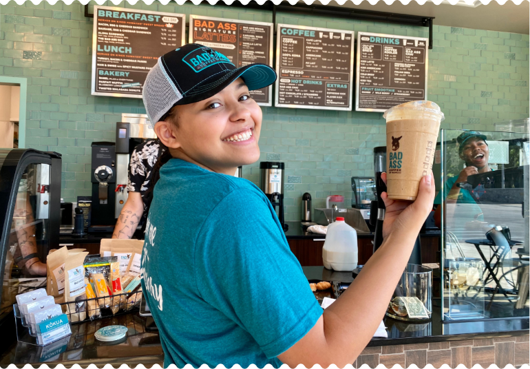 Bad Ass staff holding a coffee