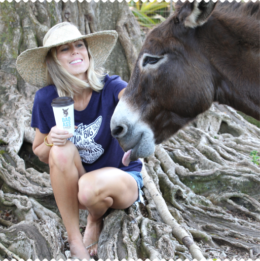 Girl with a donkey and a cup of Bad Ass Coffee